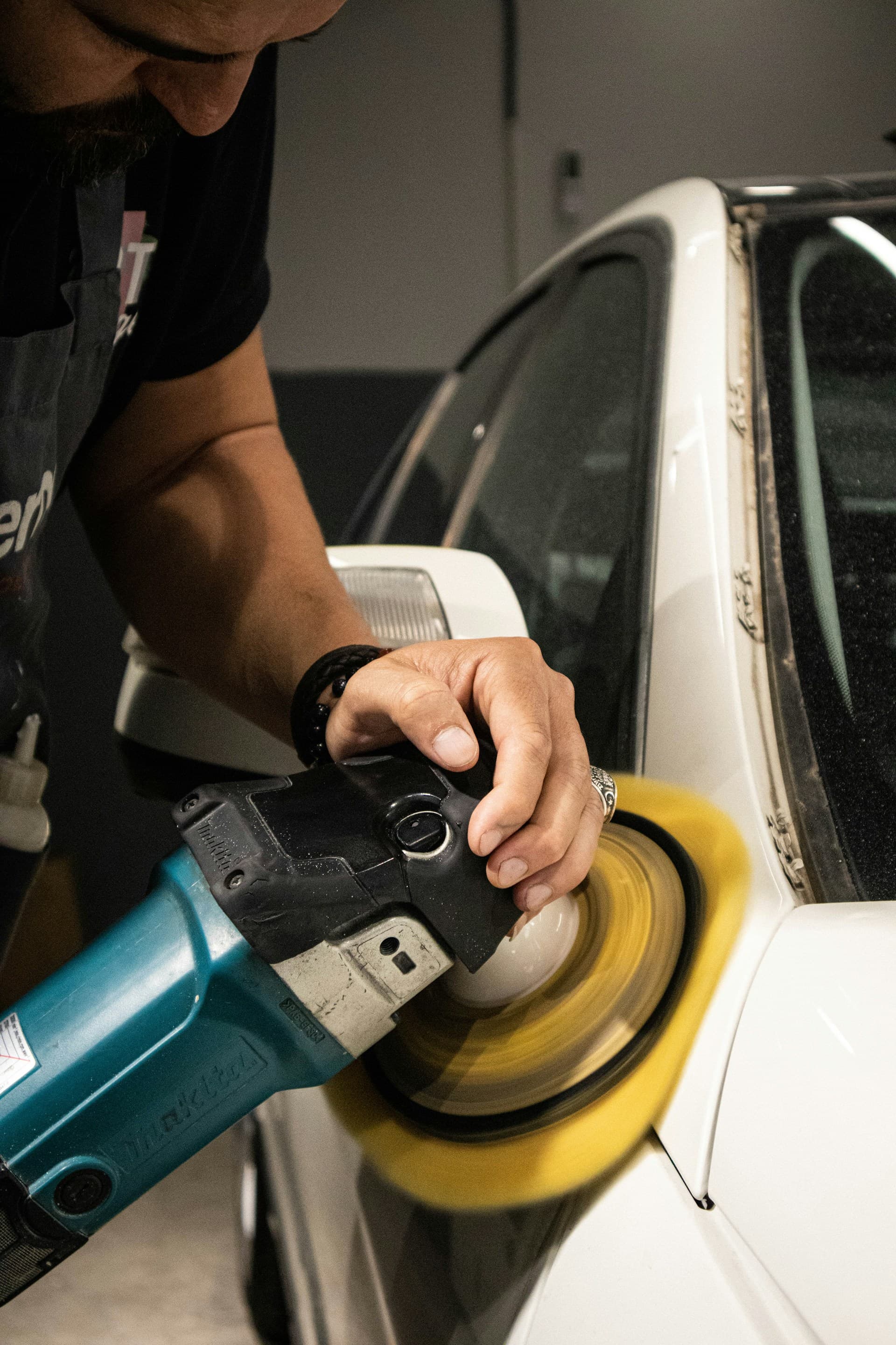 Photo of a car polishing process